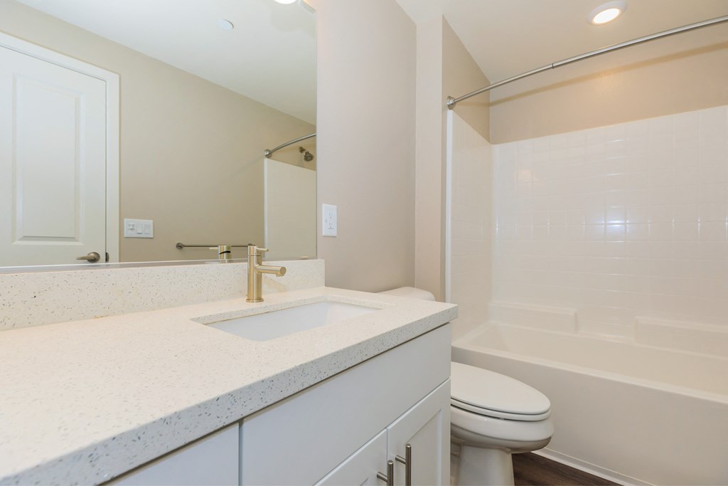 a bathroom with a sink toilet and a shower
