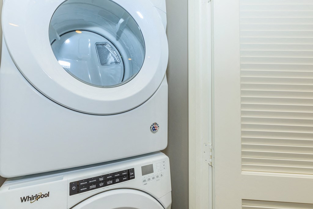 a washing machine and a dryer in a laundry room