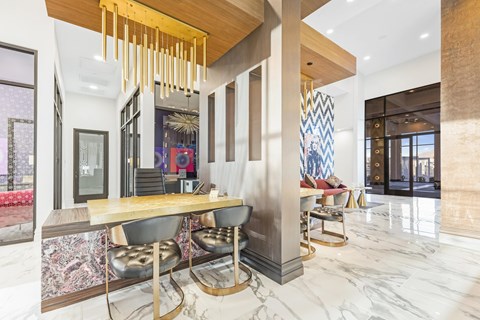 A modern dining area with a long table and chairs.