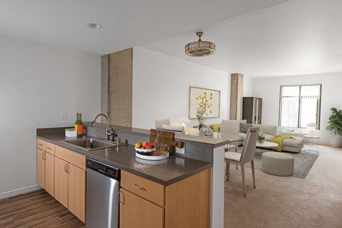 A kitchen with a dining table and chairs.