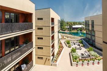 Sunnyvale CA Apartments - Exterior View of 1250 Lakeside Building During Daylight Showing Beautiful Community - Photo Gallery 5