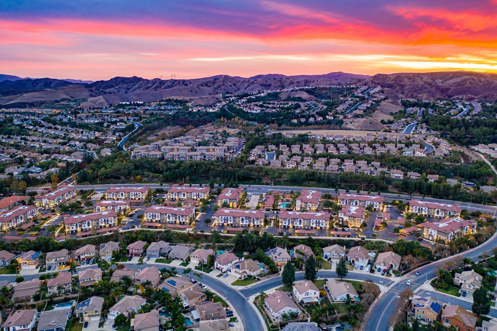 aerial view of capriana apartments and chino hill neighborhood at sunset