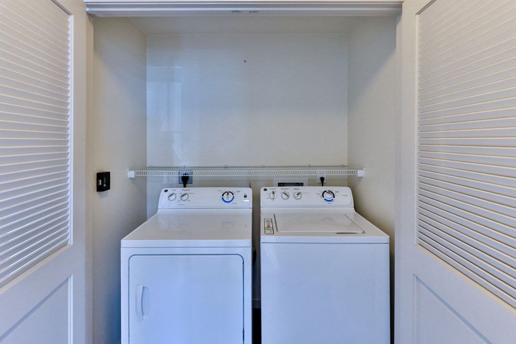 laundry closet with washer and dryer