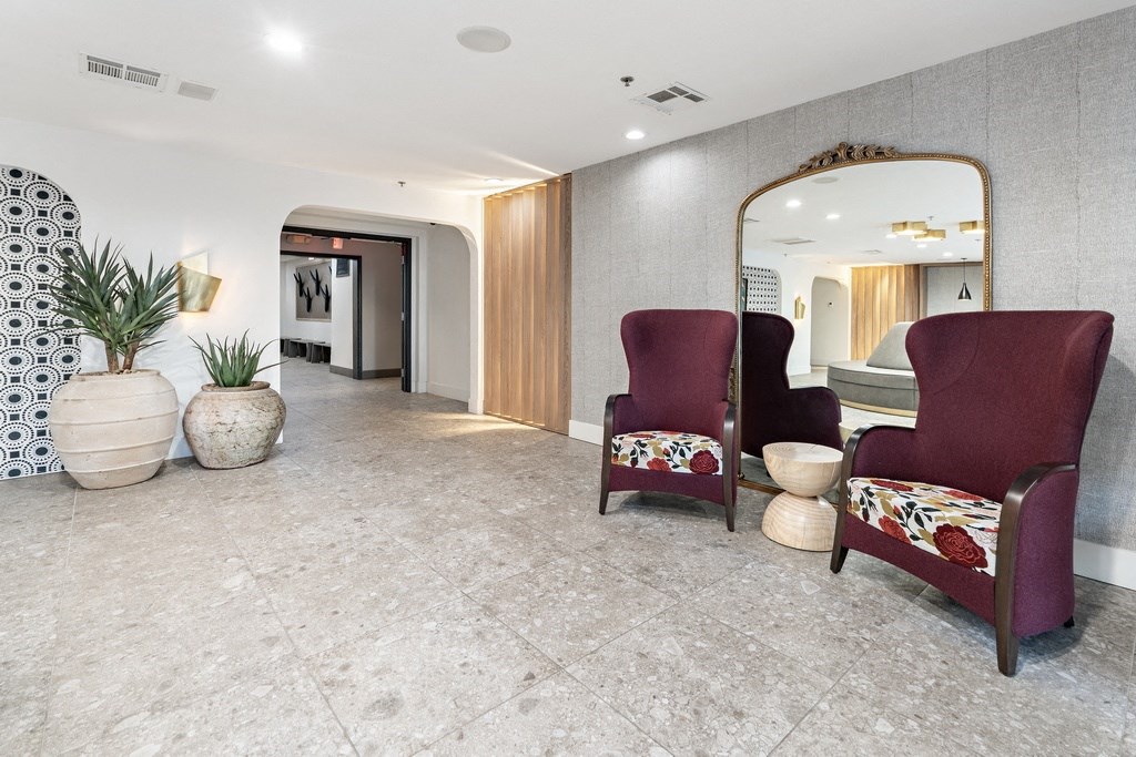 clubroom chairs with large mirror behind