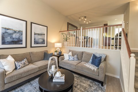 A living room with two couches and a coffee table.
