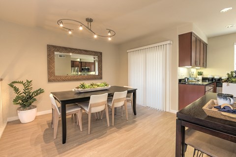 a dining room with a table and chairs