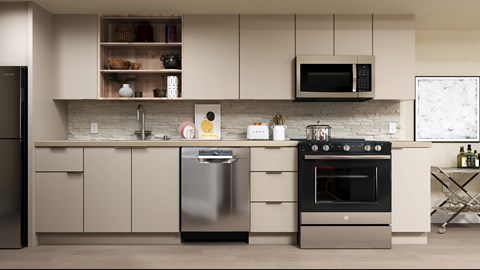 A modern kitchen with a stainless steel dishwasher and oven.