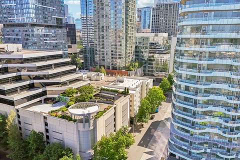 A modern cityscape with a mix of residential and commercial buildings.
