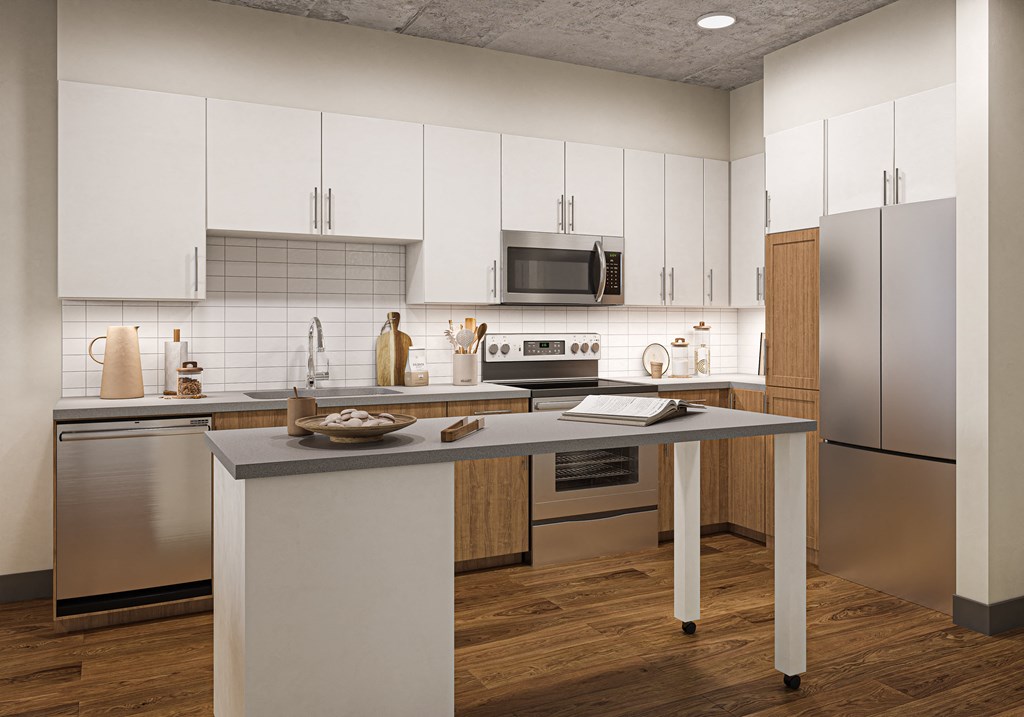 Apartments for Rent in Oakland, CA - Artizan Kitchen with stainless steel appliances and modern wood cabinets