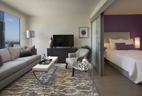 furnished bedroom and living space