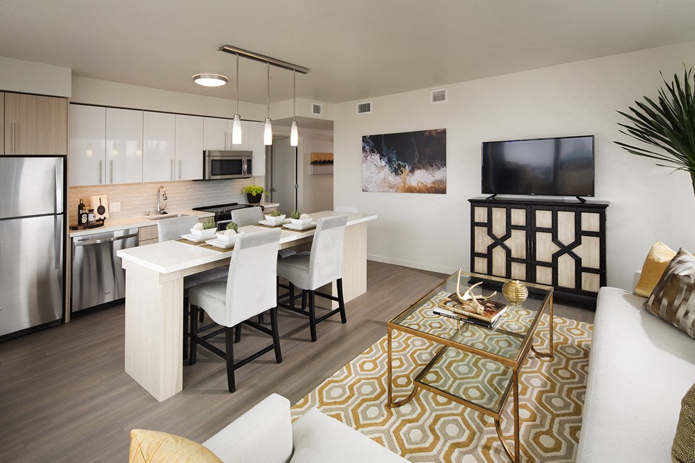 Apartments for Rent in Transbay San Francisco, CA - Solaire - Stainless-Steel Appliances, White Cabinets, White Kitchen Island, and Modern Ceiling Light Fixtures