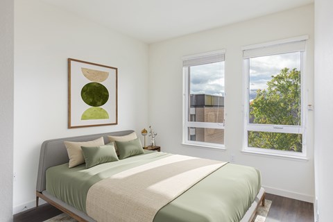 Staged bedroom photo with windows