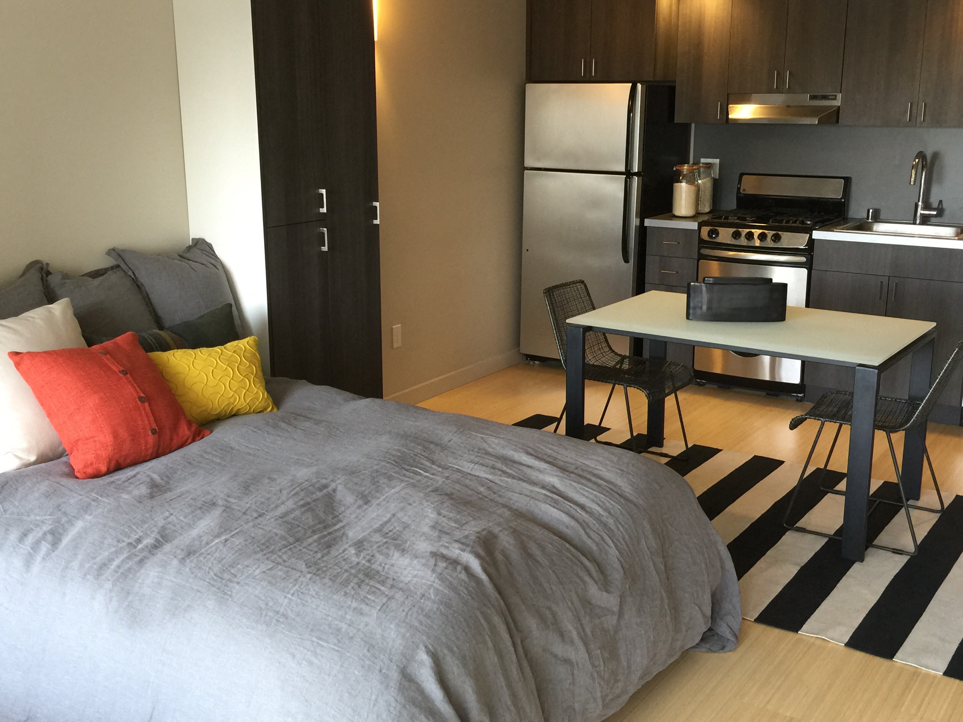 Kitchen, dining, and bed area