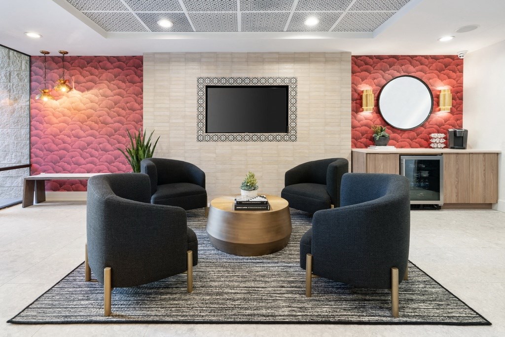 Clubroom with chairs, table and a television