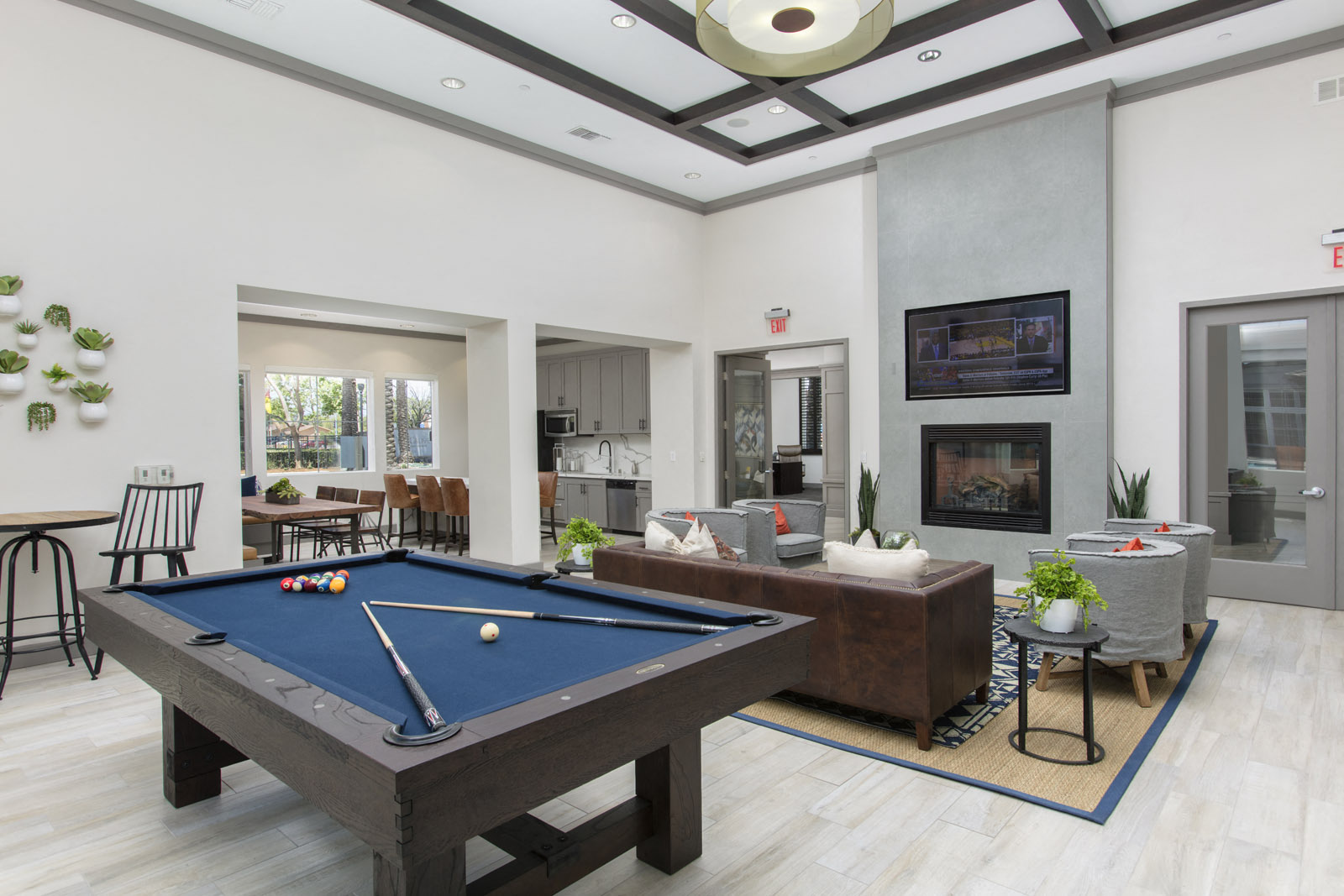 Clubroom with seating area, fireplace, TV, and pool table