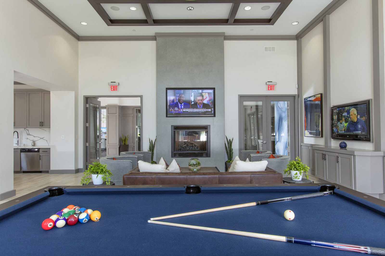 Clubroom with seating area, fireplace, TV, and pool table