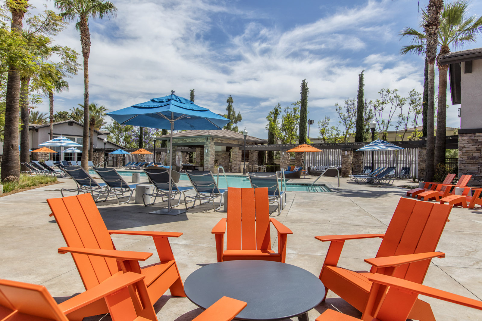Outdoor pool area with lounge chairs