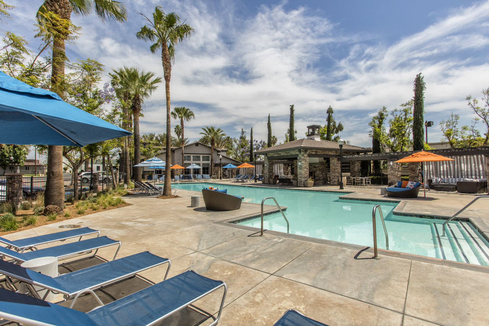 Outdoor pool area with lounge chairs