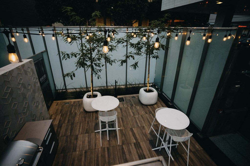 Out door area with seating and fairy lights