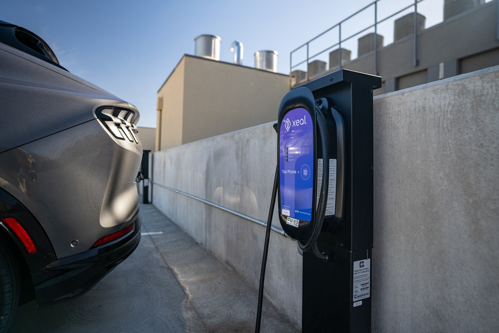 a car is parked next to a parking meter