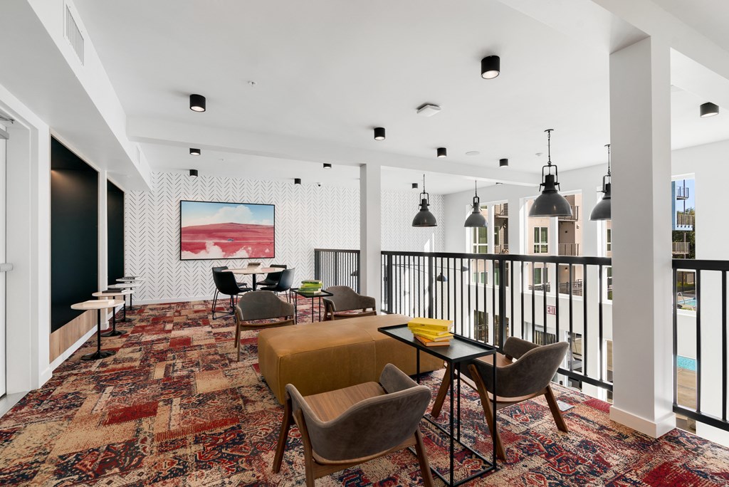 club house with a balcony and chairs and a couch