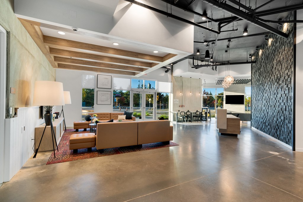 the lobby of a building with couches and chairs