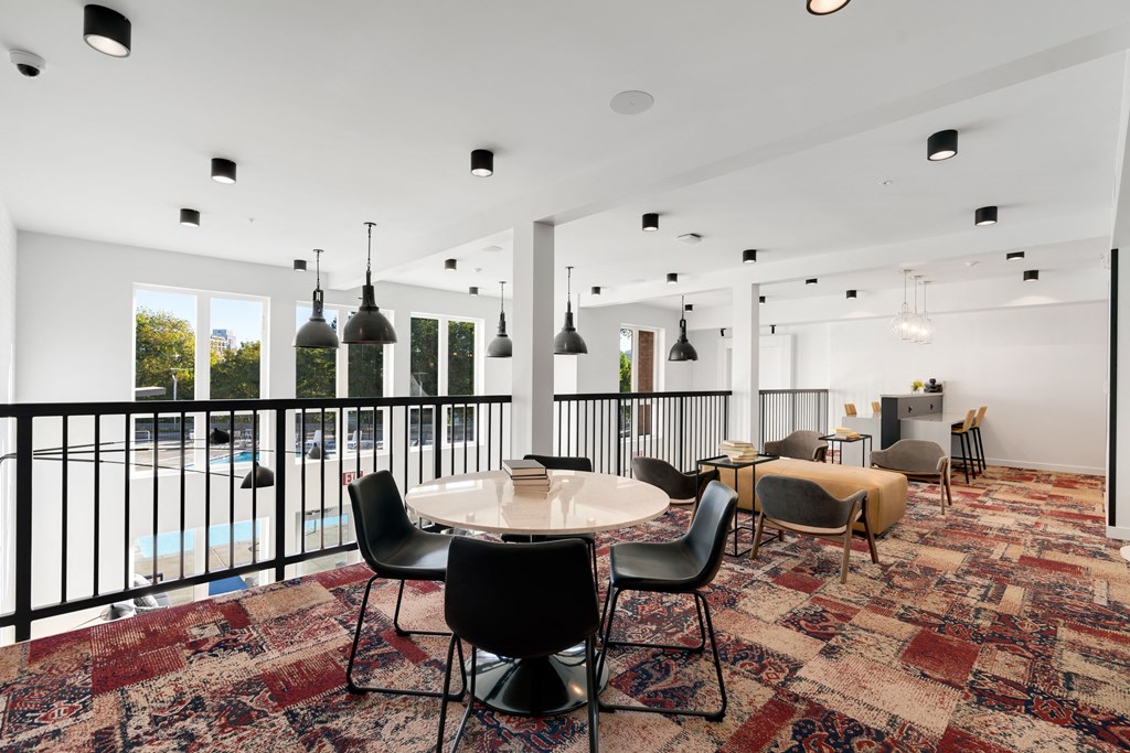 a conference room with a table and chairs and a balcony