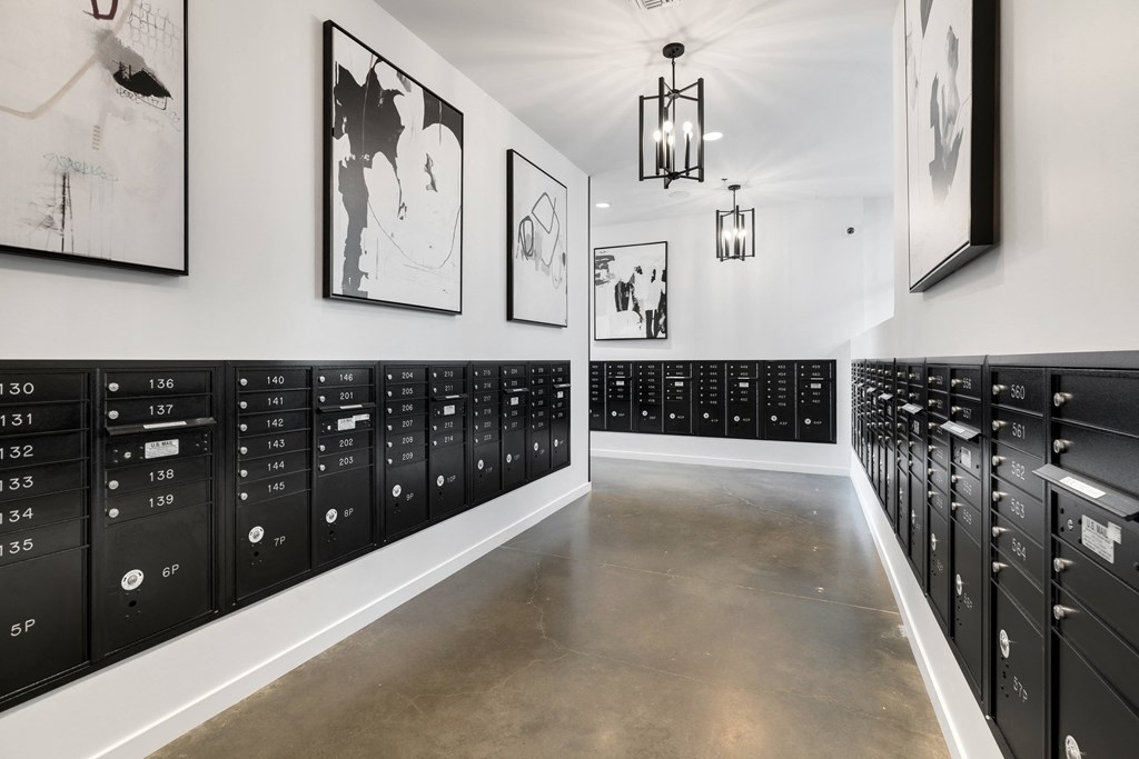 a long line of lockers in a room with pictures on the wall