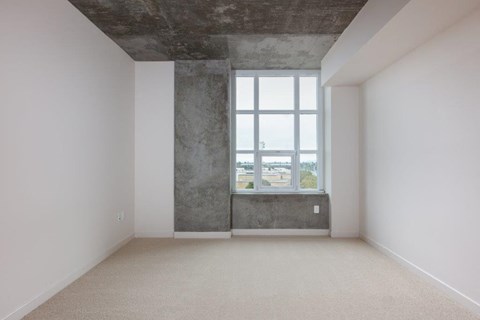 Bedroom with large windows at Aqua Via Apartments, California, 94607