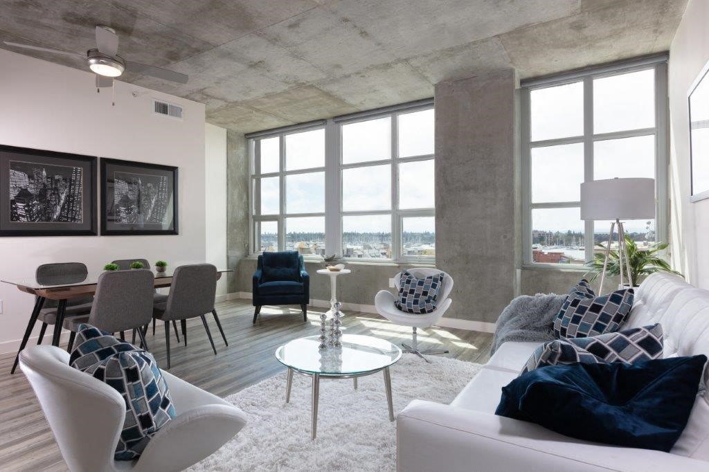 Apartments for Rent in Oakland-Aqua Via Apartments Living Room With Large Windows With City View And Vinyl Plank Flooring