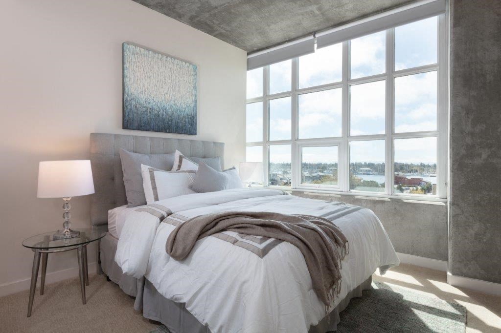 Two Bedroom Apartments in Oakland CA - Aqua Via - Bedroom with Plush Carpeting and a Large Window for Maximum Sunlight Two Bedroom Apartments in Oakland CA - Aqua Via - Bedroom with Plush Carpeting and a Large Window for Maximum Sunlight at Aqua Via Apartments, Oakland