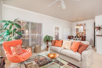 Pet-Friendly Apartments in Phoenix, AZ - Arboretum - Living Room with Plush Carpeting and Direct Access to Private Patio - Photo Gallery 2