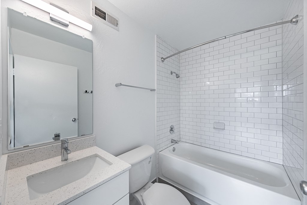 a bathroom with a sink toilet and a tub at Avenue Two Apartments, California, 94063