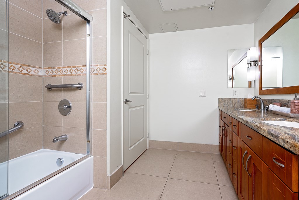 a bathroom with a bathtub and a sink