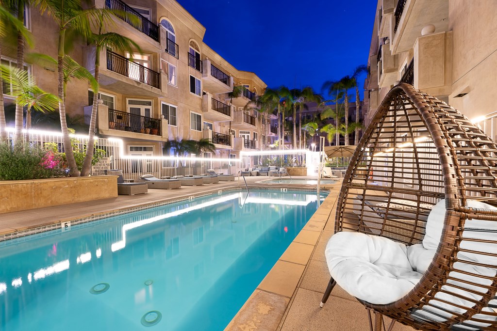 Nightime pool shot with lounge seating