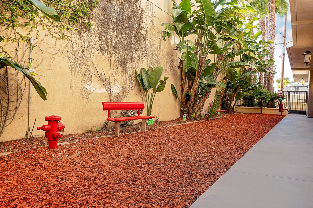 Pet friendly amenity with red bench and fire hydrant
