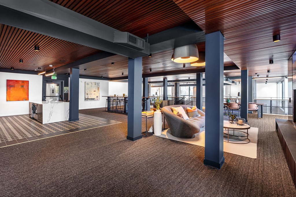 a large open space with a couch and table in the middle of the room