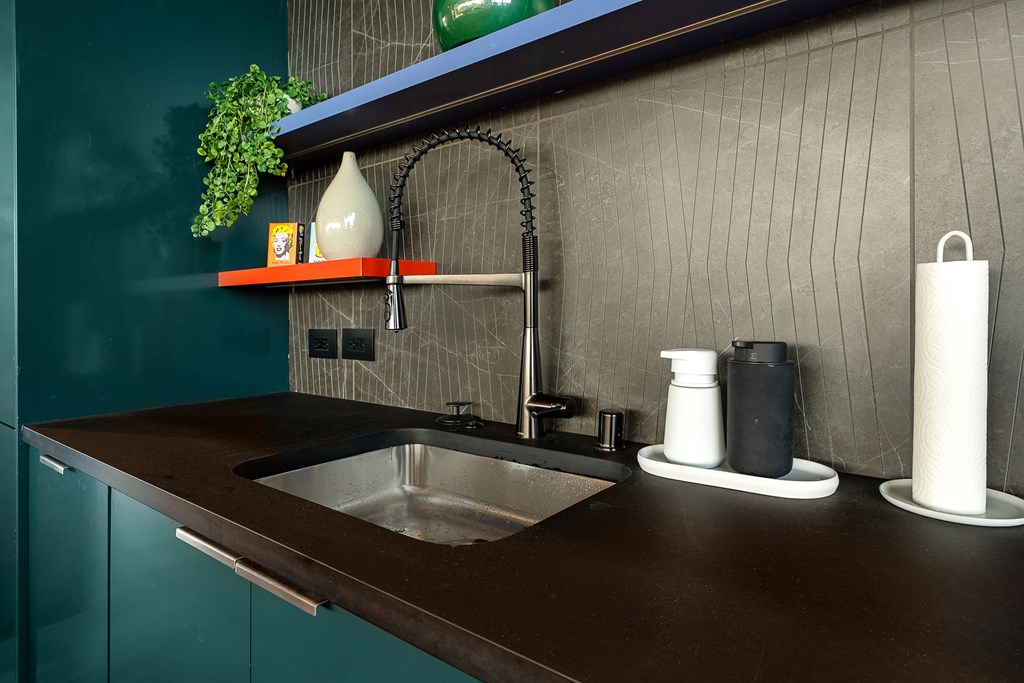 a kitchen with a sink and a counter top