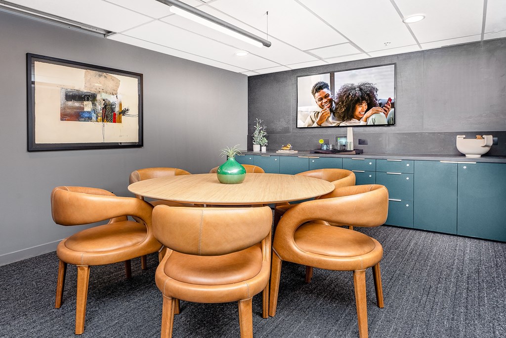 a conference room with a table and chairs