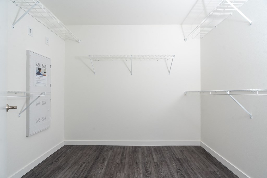 a room with white walls and a wooden floor