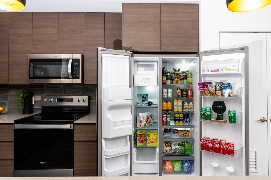a kitchen with a refrigerator freezer and a stove