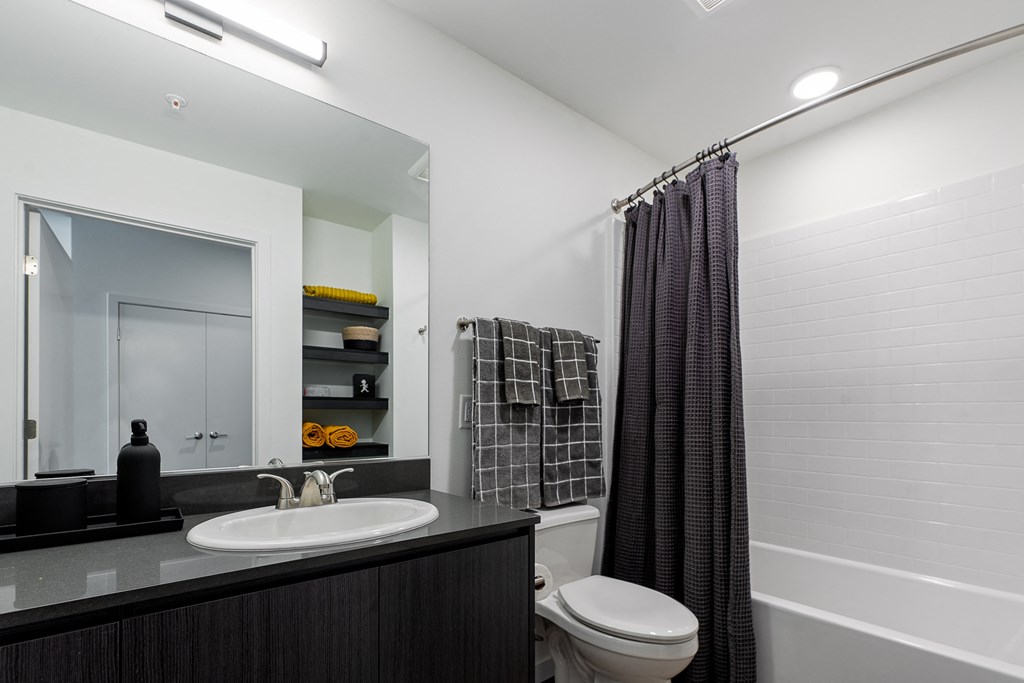 a bathroom with a toilet sink and bathtub