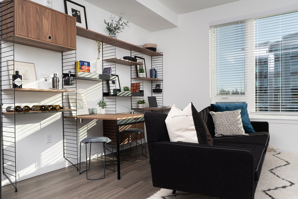 a home office with a desk and a couch