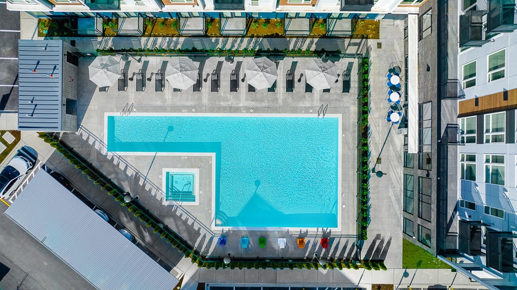 an aerial view of a large swimming pool in a city