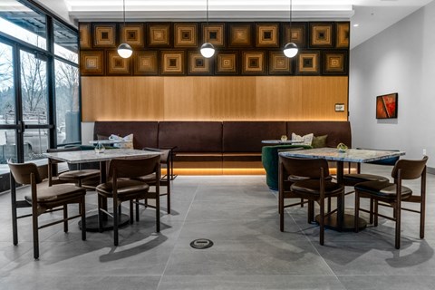 Clubroom with dining  table and chairs.