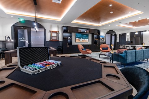 Clubroom with poker and pool table with lounge seating