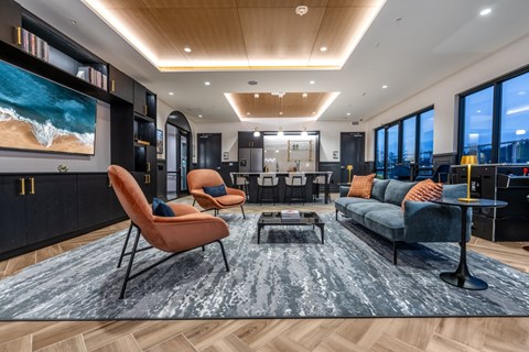 Clubroom with TV, seating and fridge