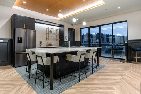 Clubroom with island, sink and fridge