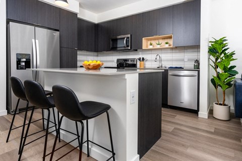 Kitchen with island and stainless steel appliances