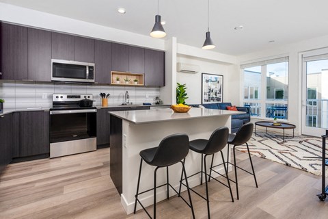 Kitchen with island and stainless steel appliances